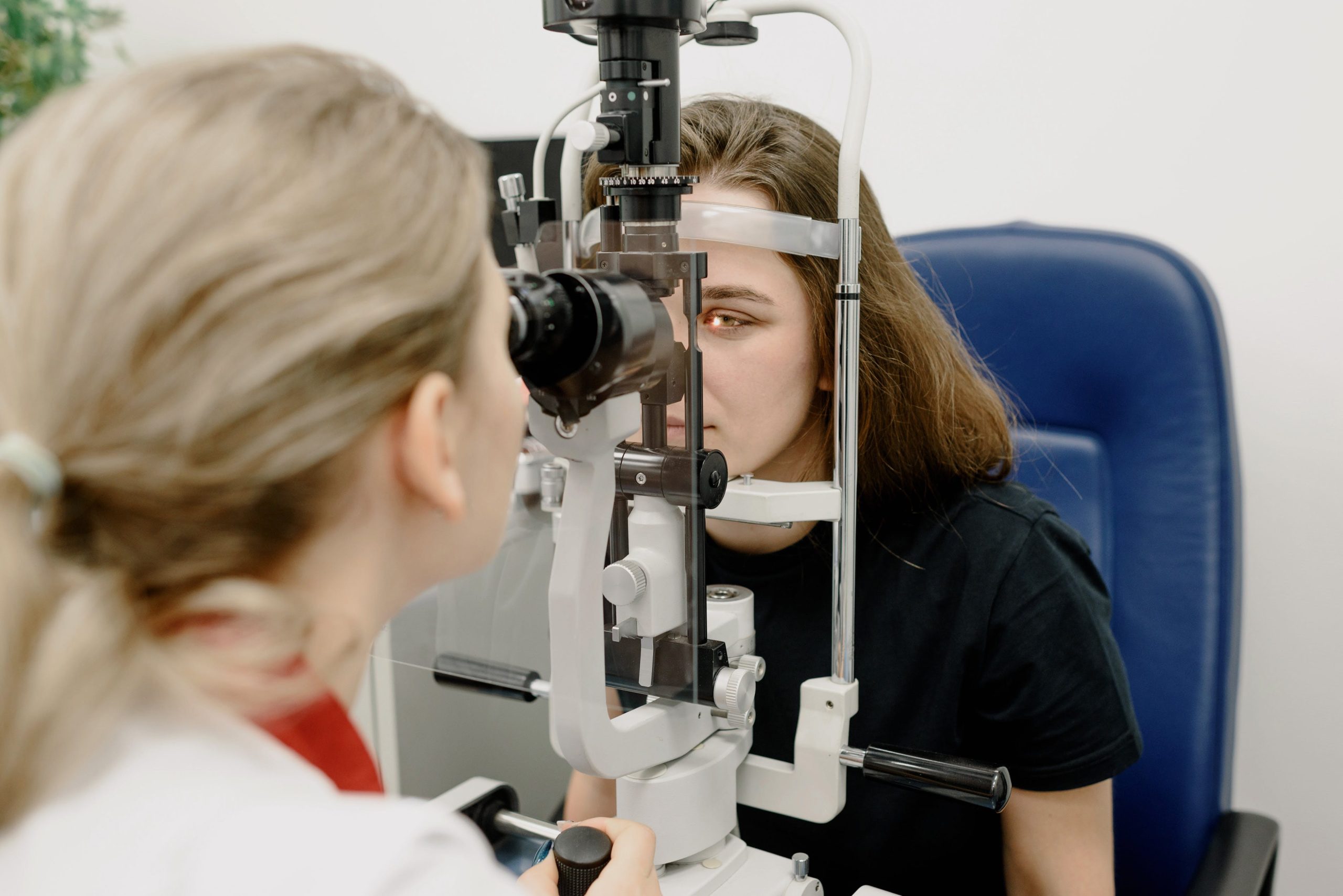 Surgical Ophthalmology medical specialty doctor looks at patient eye in hospital